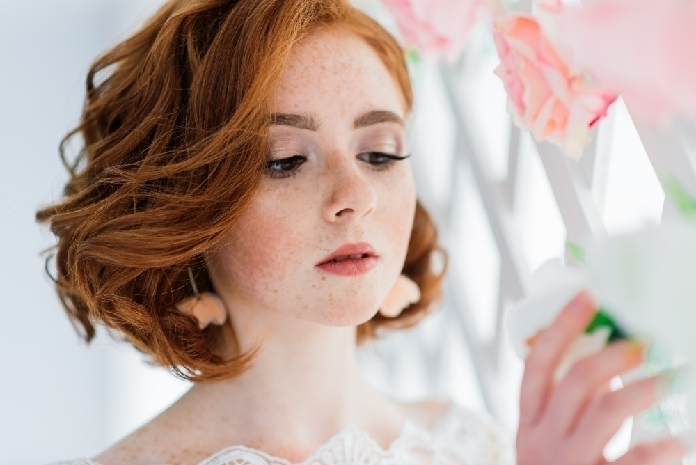 Portrait of red haired girl wearing wedding dress