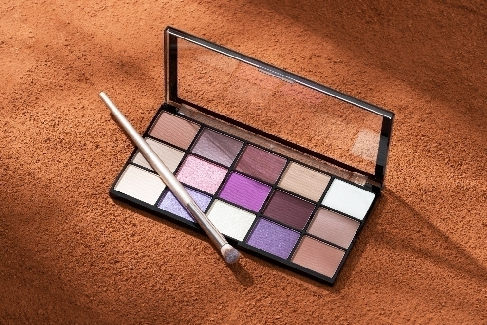 View of an eyeshadow palette with cosmetic powder